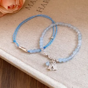 Elegantes pulseras de cuentas de piedra azul claro y cuerda trenzada con peces mujer