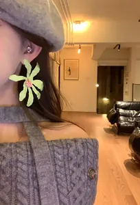 Large pale green flower earrings perfect for a sweet and elegant vacation look.