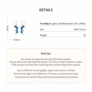 Close-up detail of blue chiffon flower and pearl ear cuffs with size specifications.