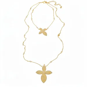 Luxury double-layered gold-tone necklace featuring pavé floral pendants and delicate chain