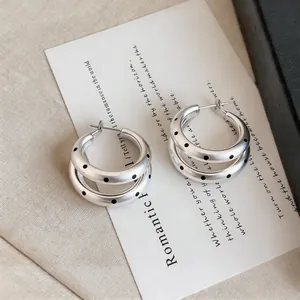 French vintage silver hoop earrings with black polka dots and multilayer design details.