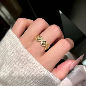 14K gold plated ring featuring round star motifs set with sparkling cubic zirconia