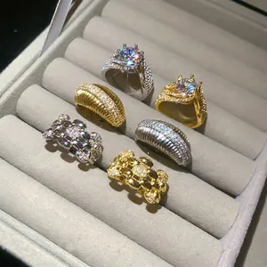 Sparkling 14k gold plated zircon geometric open rings displayed in a gray jewelry box.