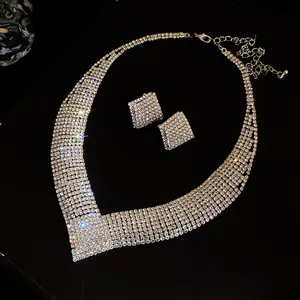 Sparkling silver rhinestone V-shaped necklace and matching earring set for evening wear
