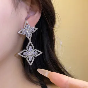 Elegant silver needle teardrop flower pendant earrings adorned with sparkling cubic zircons