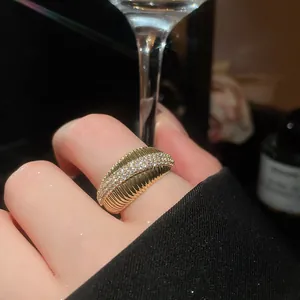 Exquisite 14k gold plated ring with micro-pave zircons detail on model finger