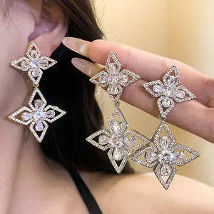 Detail view showing double floral drop earrings with sparkling cubic zirconia stones