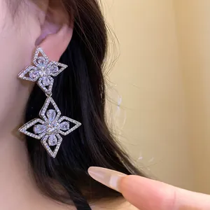 Elegant silver needle zircon teardrop flower drop earrings shown worn on the ear