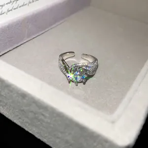 Close-up of 14k gold plated geometric open ring with sparkling zircon in a gift box