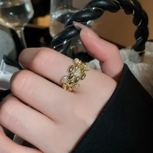 Detailed view of a 14k gold plated geometric ring with sparkling cubic zirconia