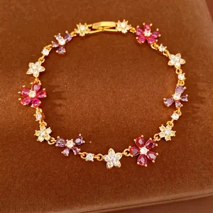 Exquisite gold-plated bracelet featuring multi-colored zirconia flowers and bow links