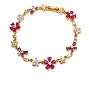 Gold-plated bracelet with colorful zircon flowers and butterfly motifs on white background