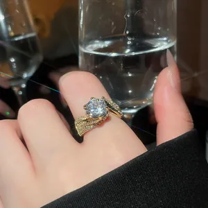 Close-up of luxury 14k gold plated round cubic zirconia ring worn on the finger