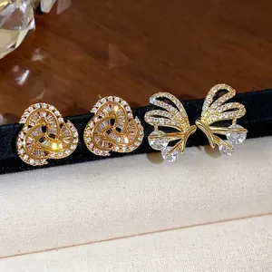 Elegant 14k gold plated butterfly and knot stud earrings set with sparkling zircons