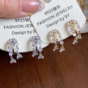 Detailed view of 18k gold plated cubic zirconia waterdrop clip-on earrings.