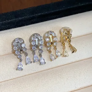 Macro view of elegant 18k gold-plated zircon waterdrop ear clips for non-pierced ears