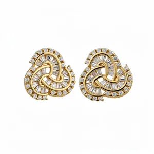 14k gold plated knotted stud earrings with sparkling baguette and round cubic zirconia