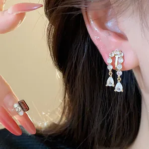 Detailed close-up of 18k gold-plated zircon water drop ear clips for non-pierced ears