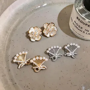 Elegant 18k gold plated zircon bow clip-on earrings set with pearls and flower motifs