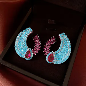 Elegant luxury crescent earrings with turquoise micro-pave and ruby-red teardrop stones