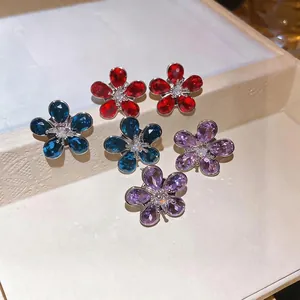 Elegant silver needle flower earrings with sparkling red, blue, and purple zircons.