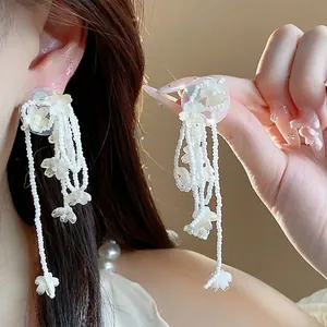 Elegant glass flower tassel earrings with silver needles for a stylish resort look