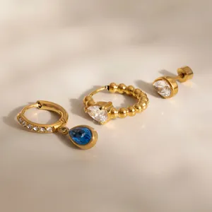 Detailed shot of teardrop zirconia earring set in gold-plated stainless steel finish