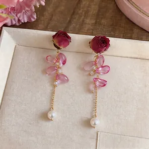 Elegant preserved red rose stud earrings with pink crystal beads and pearl tassels