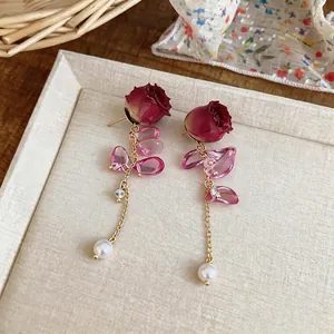 Elegant sweet preserved rose flower earrings featuring pearl tassels and pink crystal petals