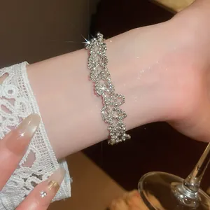 Close-up of elegant French style sparkling silver beaded bracelet on wrist