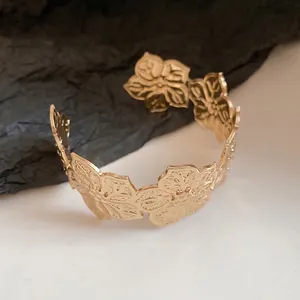 Elegant gold-tone pleated floral open cuff bracelet with minimalist design