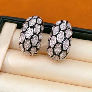 Boucles d'oreilles en C plaqué or 18 carats avec motif hexagonal en zircone en coffret