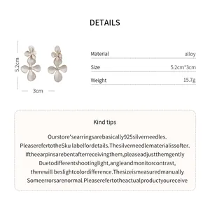Detailed view of retro floral alloy stud earrings with size and material specifications