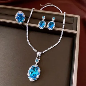 Elegant jewelry set featuring sparkling oval blue zirconia necklace earrings and ring