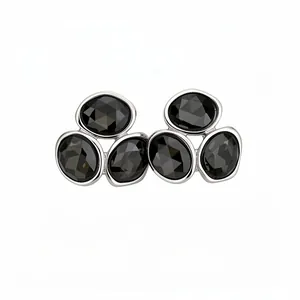 Elegant silver-tone stainless steel stud earrings with faceted black stones cluster design