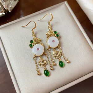 Vintage 14K gold plated earrings with white jade-like stones and green teardrop accents.