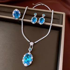 Detailed macro view of elegant blue oval zircon necklace earring and ring jewelry set