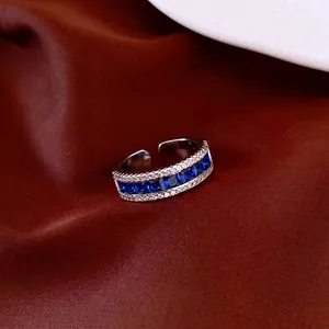Elegant vintage silver ring featuring royal blue square zircons and white pavé stone accents