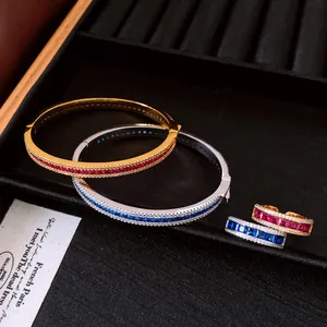 Detailed view of luxury vintage palace style zircon bangle and ring set in gold and silver
