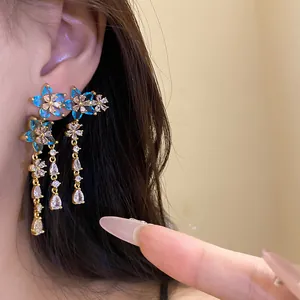 Detailed view of high-end silver needle zircon flower earrings with water drop tassels