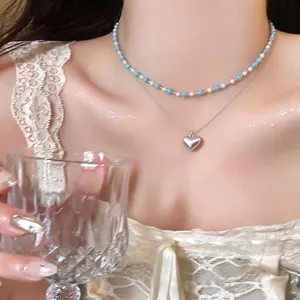Double-layered Korean style necklace with blue beaded choker and silver heart pendant