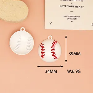 Detail shot of white baseball alloy pendant with red stitching for DIY jewelry