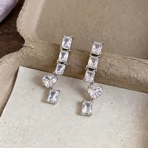 Elegant silver needle earrings with square and heart-shaped cubic zirconia crystals