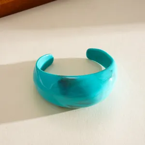 Detailed close-up view of a thick turquoise marble texture acrylic geometric cuff bangle