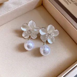 Elegant French retro flower drop earrings featuring rhinestones and white pearls