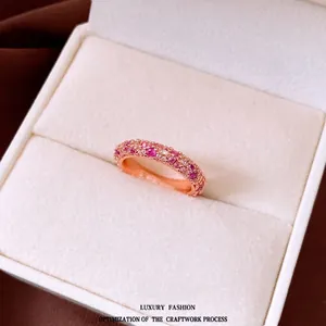 Elegant rose gold eternity ring with pink and white zircons in a gift box