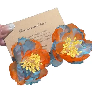 Handmade chiffon flower stud earrings in vintage blue and orange floral design.