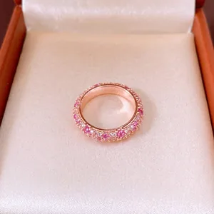 French vintage style eternity ring with pink and white cubic zirconia in rose gold