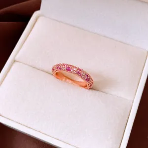 Exquisite macro view of French vintage style ring featuring pink and white zircon stones