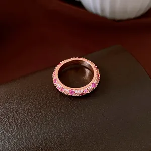 Close-up of rose gold zircon full star ring with pink and white pavé crystals